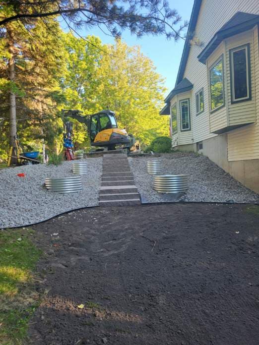 Project Granite Steps, Gravel and Custom Planters Fix a Tricky Slope image